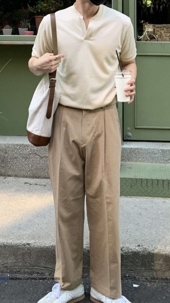 Ivory split-neck knit top + Canvas sling tote + Sand-beige pleated chinos + White retro trainers