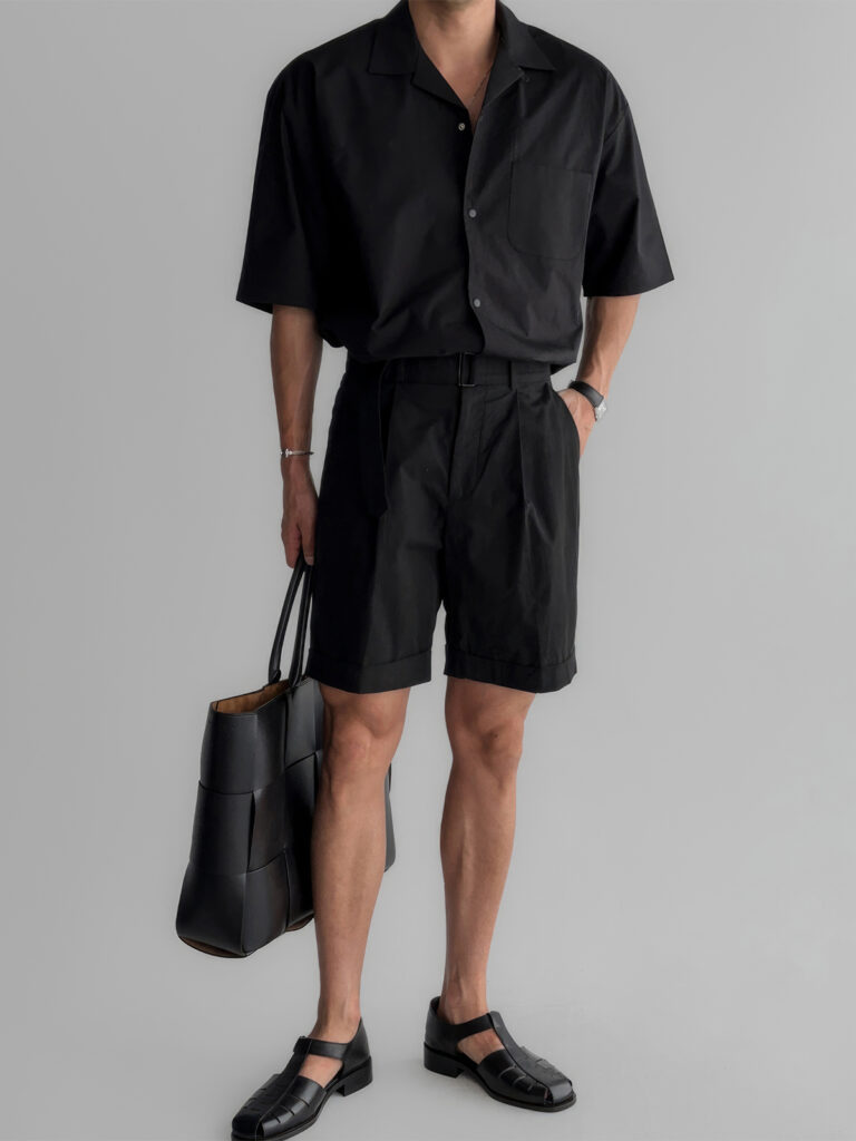 Minimalist Bracelet + Black Camp-Collar Shirt + Slim Black Belt + Pleated Black Shorts + Woven Leather Tote + T-Bar Loafers