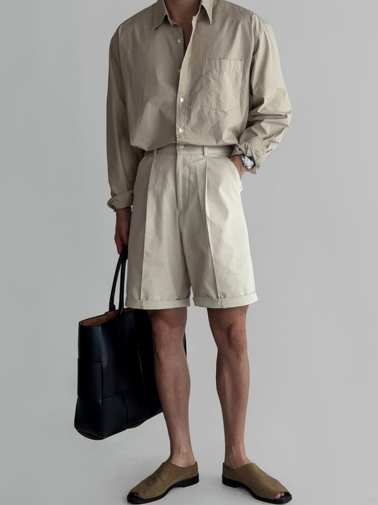 Clean crop + crisp beige poplin shirt + beige tailored shorts + brown suede slides + black woven tote