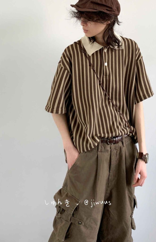 Chocolate newsboy cap + Nougat-stripe knit polo + Walnut leather cord cross-body + Cargo front-pleat field trousers + Bronze field watch + Tobacco suede hikers