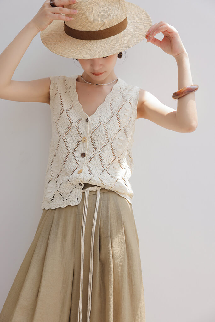 Straw fedora hat + crochet button-front vest + khaki rope-waist maxi skirt