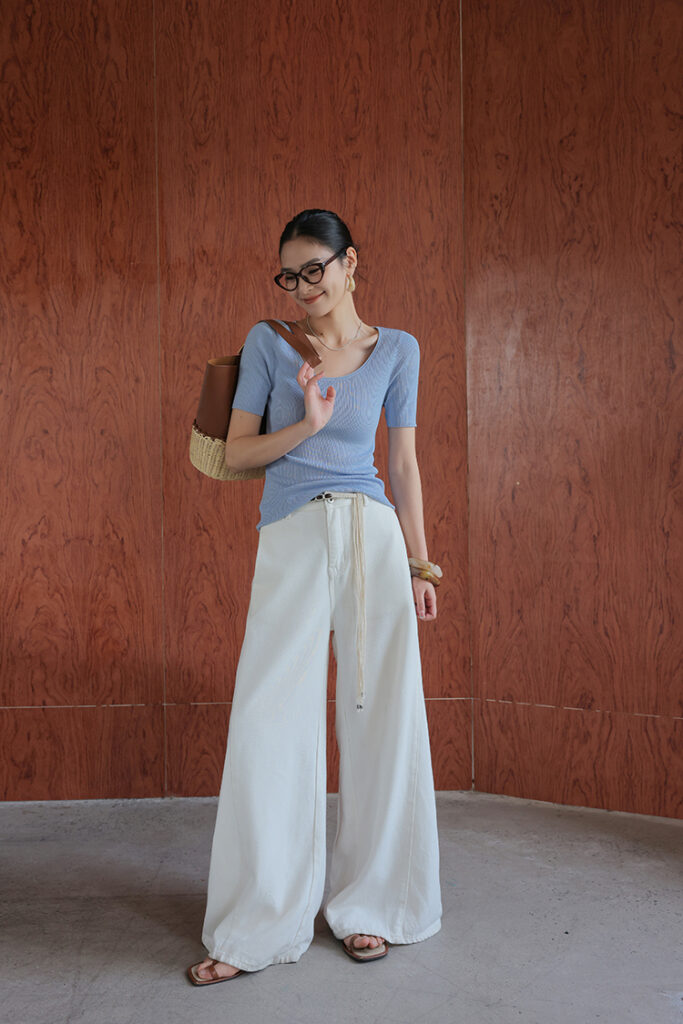Cat-eye glasses + powder-blue ribbed knit tee + white rope-belted palazzos + brown sandals