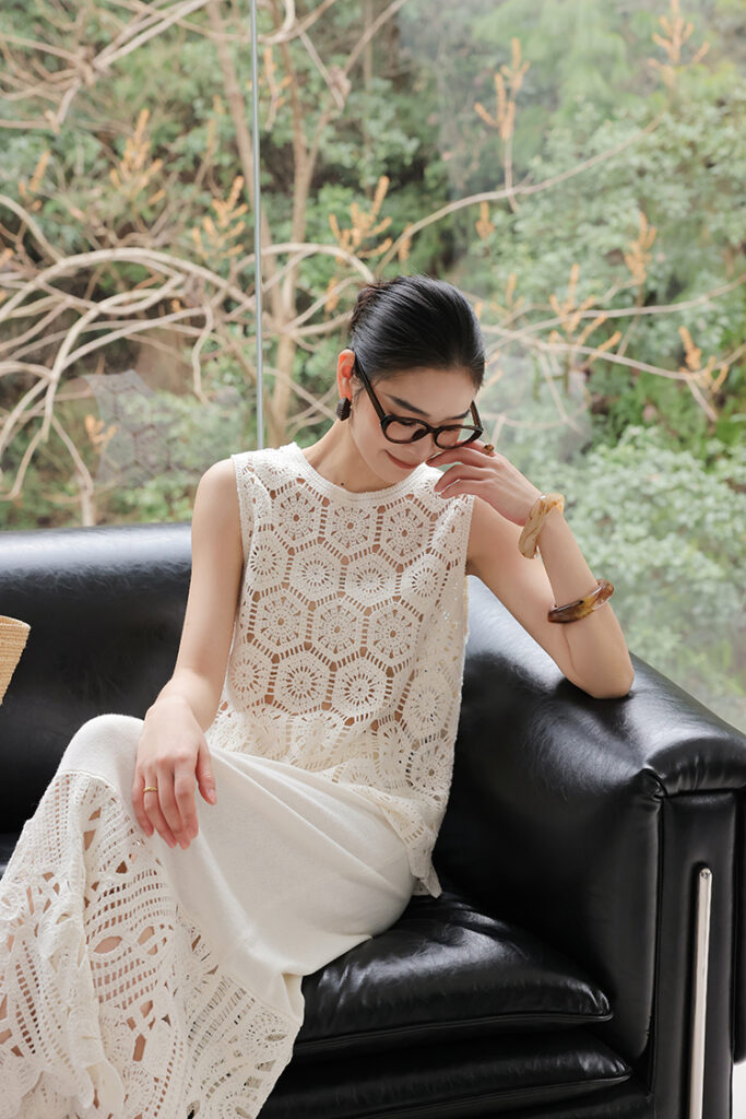 Cat-eye glasses + ivory crochet shell + ivory crochet-border skirt + straw tote