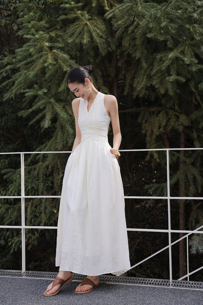 Delicate Stud Earrings + White Ruched Halter Maxi Dress + Brown Cross-Strap Sandals
