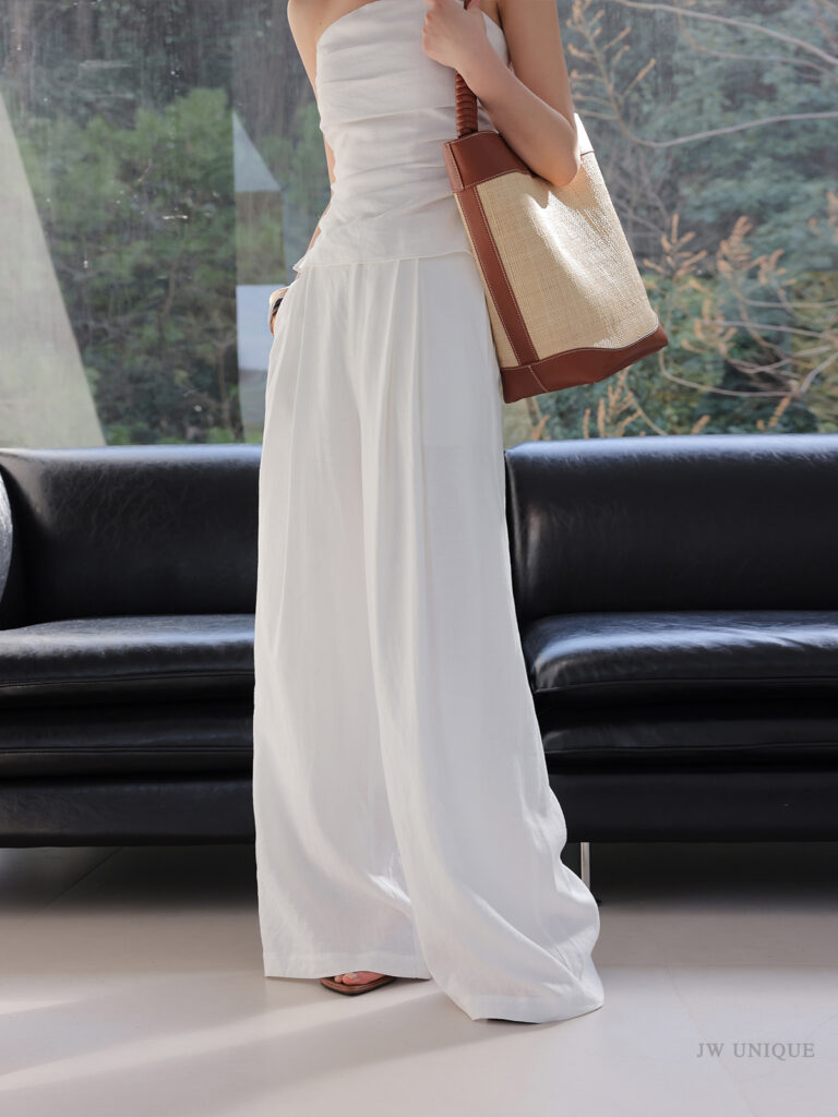 Pearl choker + white lace-yoke shirt + white rib tank + white mini skort + straw bucket tote