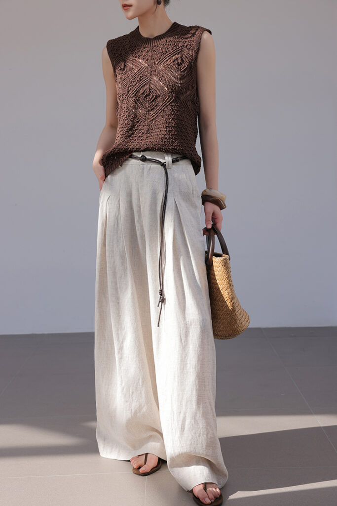 High bun + stud earrings + brown crochet knit tank + rope belt + oatmeal linen wide-leg pants + structured straw tote + brown sandals